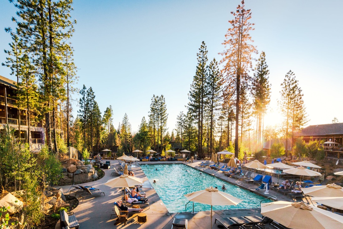 Rush Creek Lodge & Spa pool and woodland setting at sunset near Yosemite